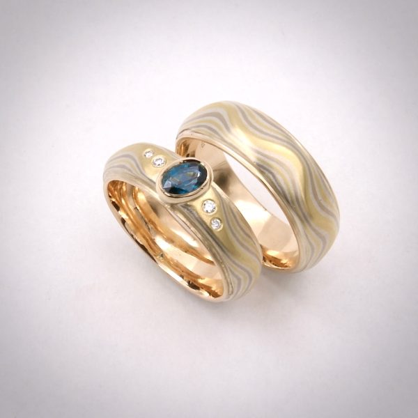 mokume gane, guri bori carved mokume, hand fabricated mokume, 18k yellow gold, 14k palladium white gold, sterling silver, 14k yellow gold liner, mokume gane rings, wedding rings, sapphire, diamonds